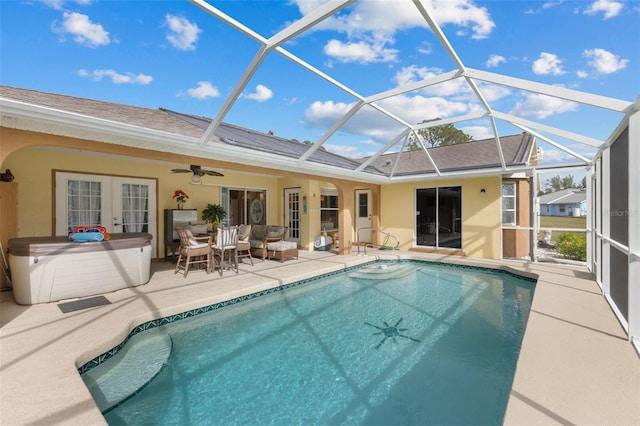 view of pool featuring a lanai, a patio, and french doors