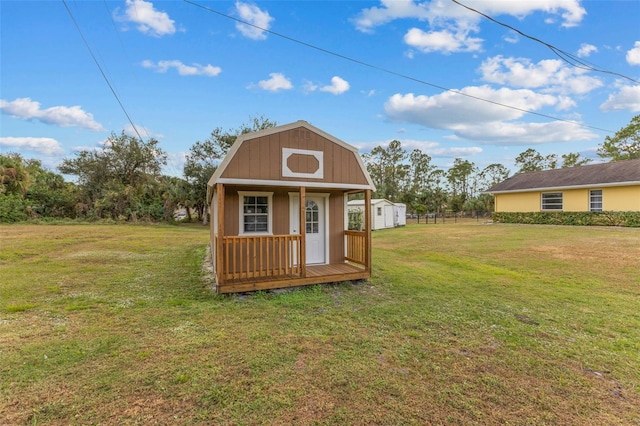 view of outbuilding with a yard