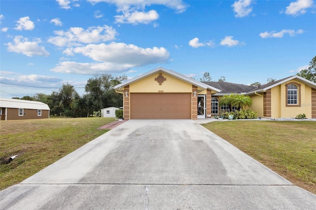 single story home with a front yard and a garage