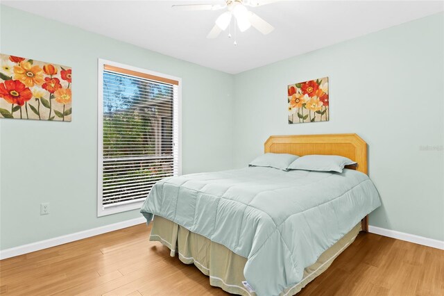 bedroom featuring ceiling fan and wood-type flooring