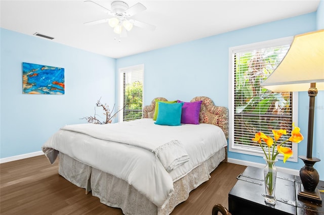 bedroom featuring ceiling fan and dark hardwood / wood-style flooring