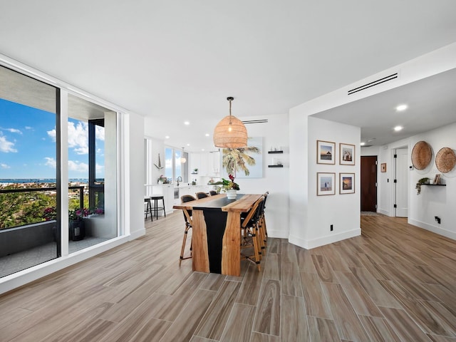 dining space featuring light hardwood / wood-style flooring