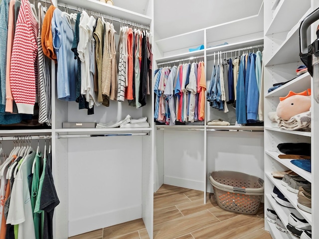 spacious closet featuring light wood-type flooring