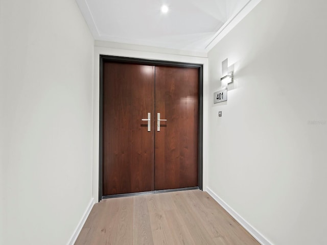 doorway with light wood-type flooring