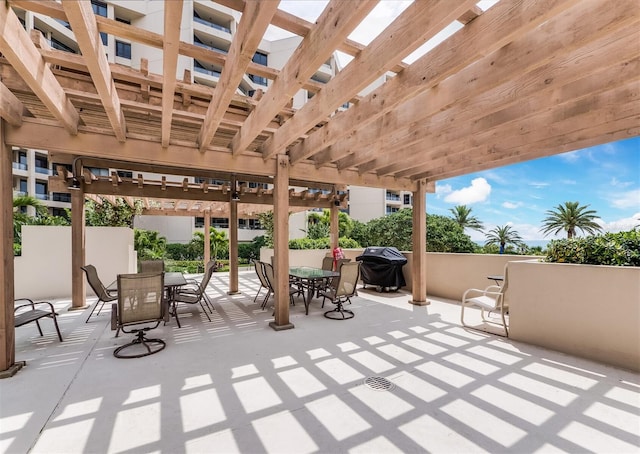 view of patio with a pergola and area for grilling