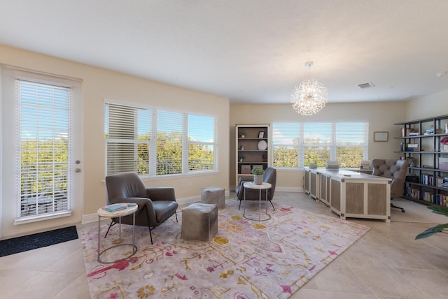 living area featuring light tile patterned flooring and a chandelier