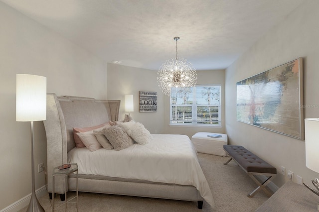 bedroom featuring carpet floors and a notable chandelier