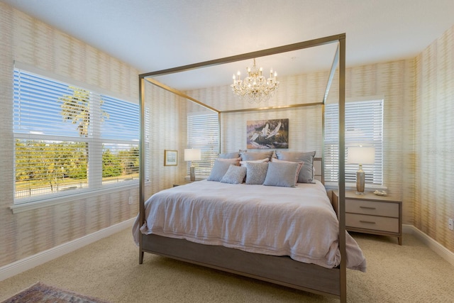 carpeted bedroom featuring a notable chandelier