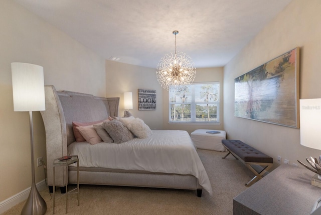 bedroom with carpet and a notable chandelier