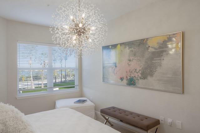 bedroom featuring an inviting chandelier