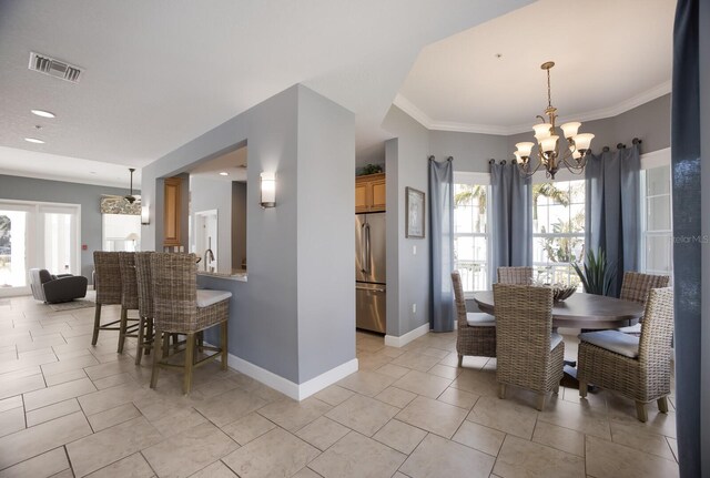 tiled dining area featuring crown molding and a notable chandelier