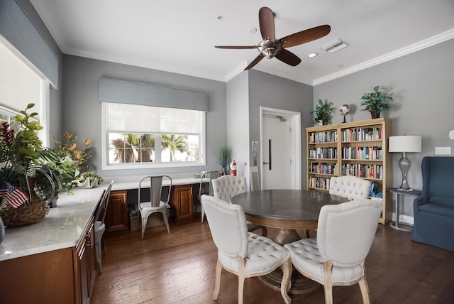 dining room with dark hardwood / wood-style floors, ceiling fan, and crown molding