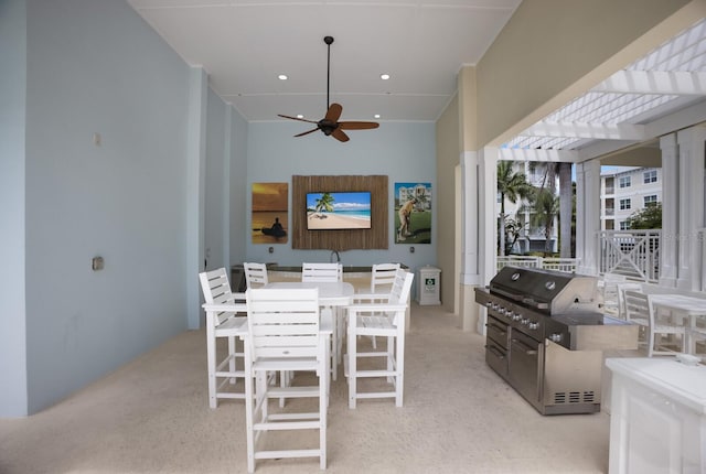 view of patio / terrace featuring a pergola, ceiling fan, and grilling area