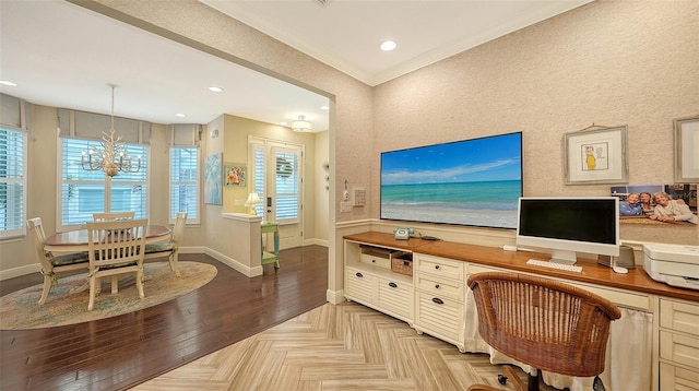 office space featuring light parquet floors, ornamental molding, and a notable chandelier