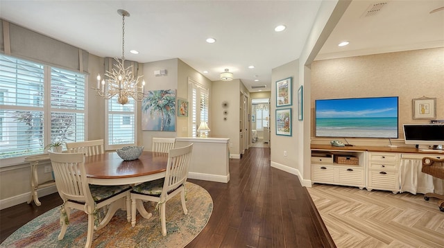 dining area featuring a chandelier and light hardwood / wood-style flooring