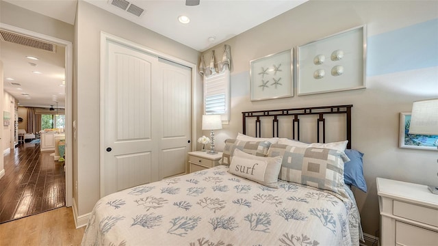 bedroom with a closet and wood-type flooring