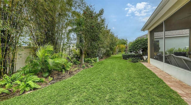 view of yard with a sunroom