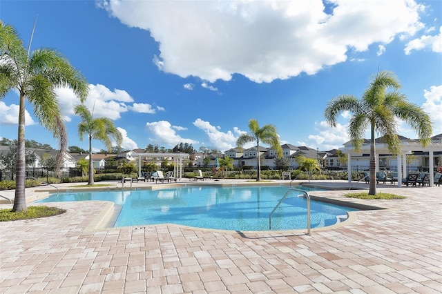 view of swimming pool featuring a patio area