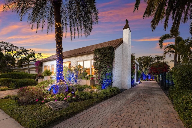 view of property exterior at dusk