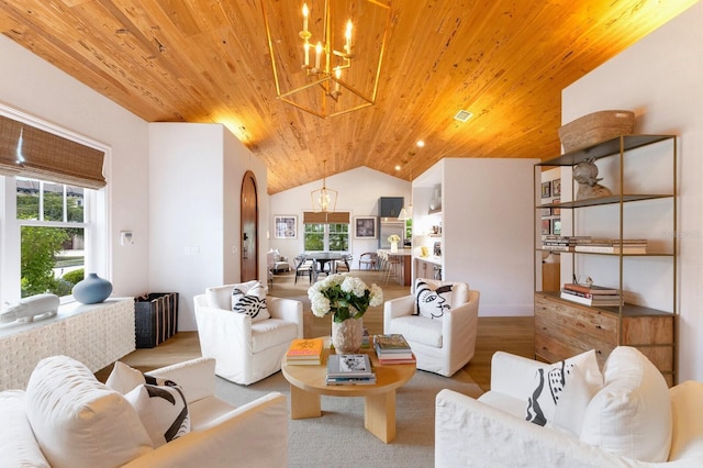 living room featuring vaulted ceiling, wood ceiling, and an inviting chandelier