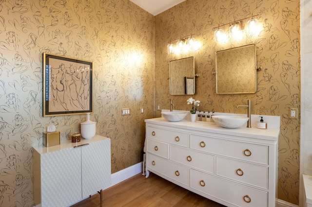 bathroom featuring hardwood / wood-style floors and vanity