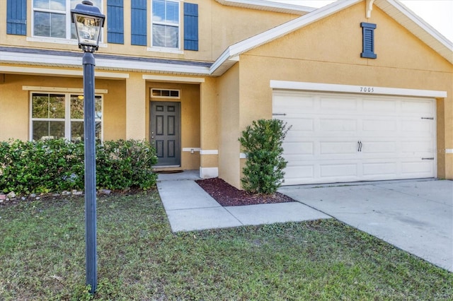 entrance to property with a yard