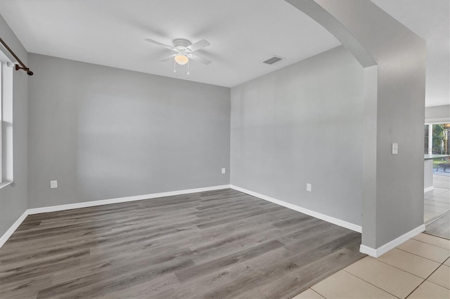 spare room with ceiling fan and light hardwood / wood-style flooring