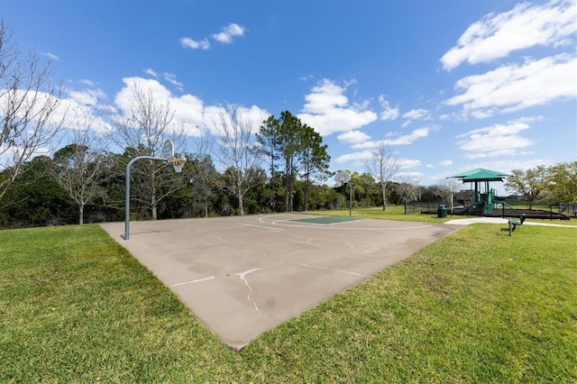 view of sport court featuring a playground and a lawn