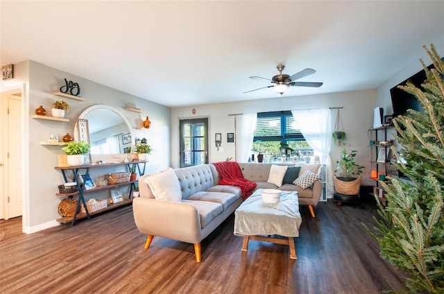 living room featuring dark hardwood / wood-style floors and ceiling fan