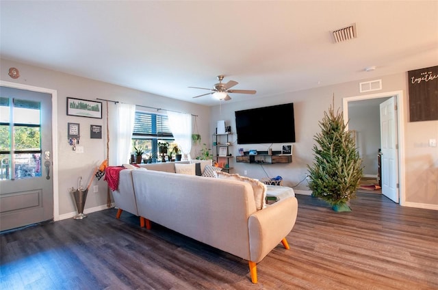 living room featuring dark hardwood / wood-style floors and ceiling fan