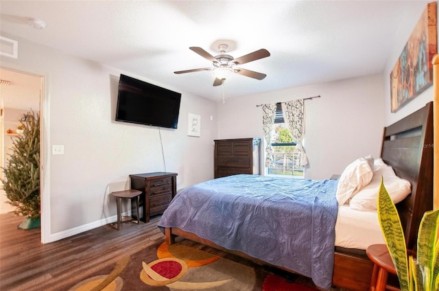 bedroom featuring dark hardwood / wood-style flooring and ceiling fan