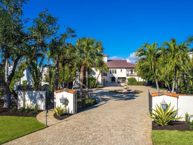 mediterranean / spanish-style home with a balcony