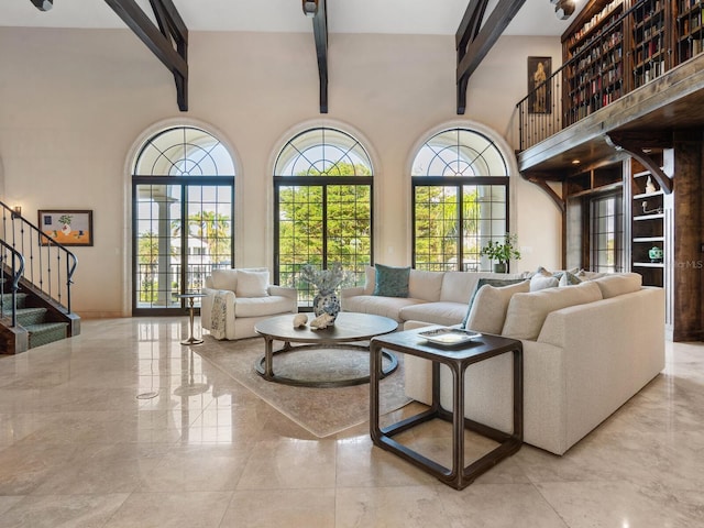 living room featuring beam ceiling