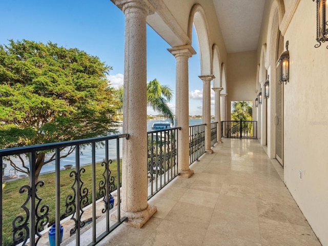 balcony featuring a water view