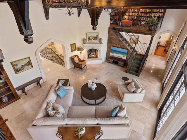 living room featuring a high ceiling and an inviting chandelier