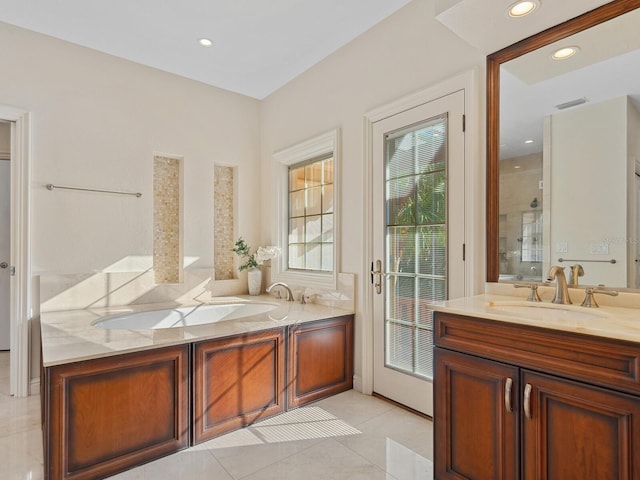 bathroom with tile patterned floors and vanity