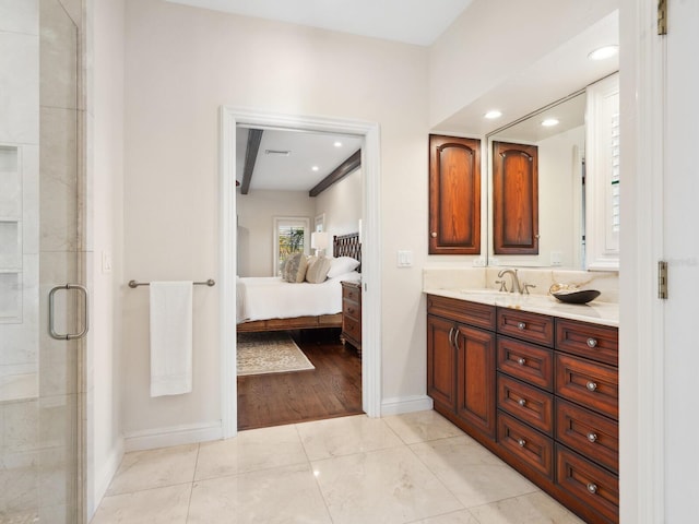 bathroom with tile patterned floors, vanity, and a shower with shower door