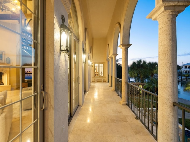 view of balcony at dusk