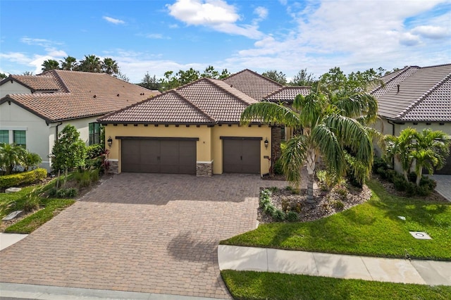 mediterranean / spanish house featuring a garage