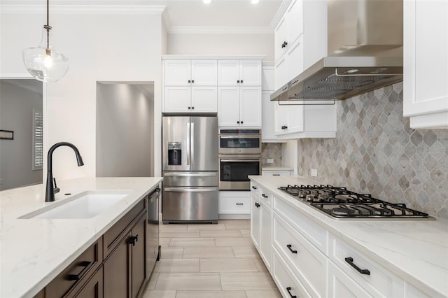 kitchen with light stone countertops, sink, wall chimney exhaust hood, stainless steel appliances, and white cabinets