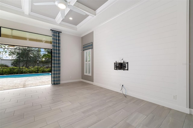 unfurnished room featuring beamed ceiling, ceiling fan, ornamental molding, and coffered ceiling