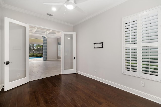 empty room featuring french doors, coffered ceiling, ceiling fan, ornamental molding, and dark hardwood / wood-style flooring