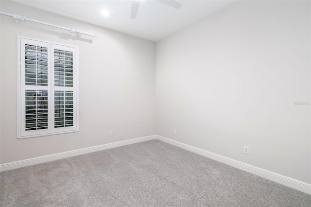 spare room featuring carpet floors and ceiling fan