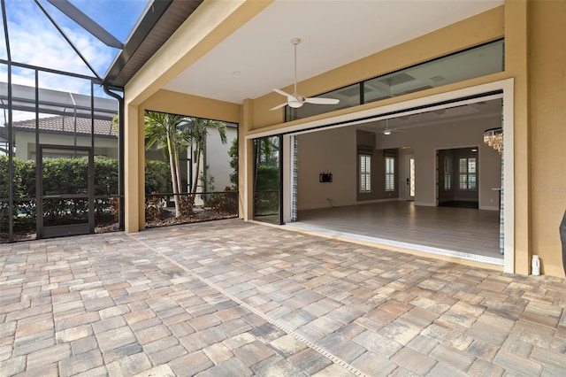 view of patio / terrace featuring a lanai and ceiling fan