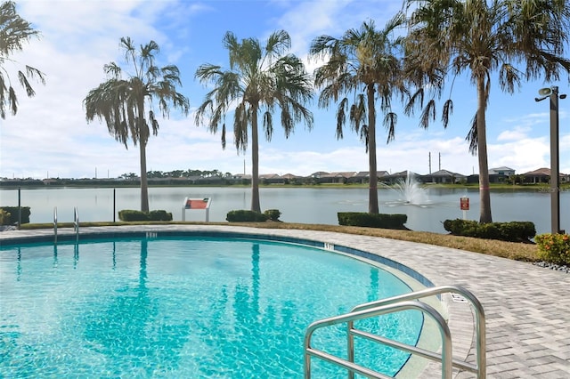 view of pool with a water view