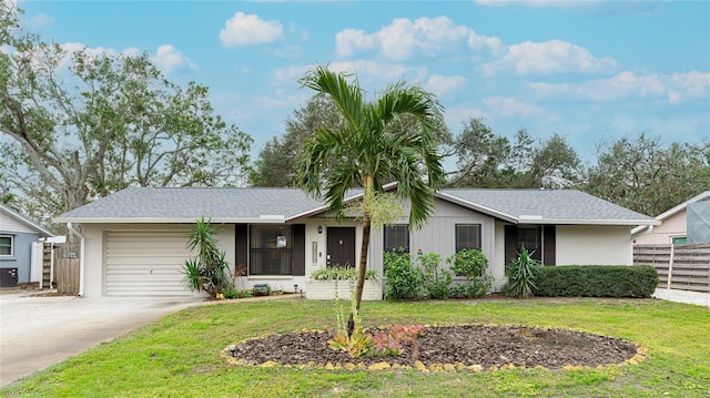 ranch-style house with a front lawn and a garage