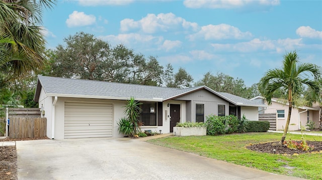 ranch-style home featuring a garage and a front lawn