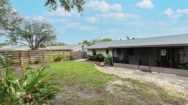 view of yard featuring a sunroom