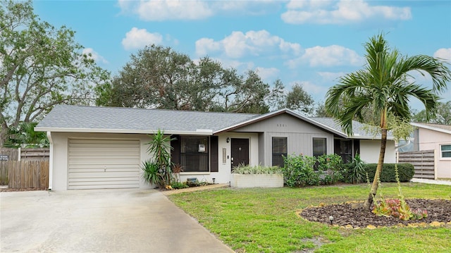 ranch-style house with a front lawn and a garage