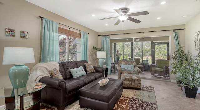 tiled living room with ceiling fan